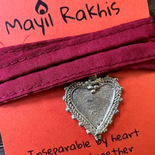 wrist wraps by mayil with colorful silk strings and dokhra heart charms