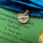 wrist wrap with an unique dokra charm by MAYIL