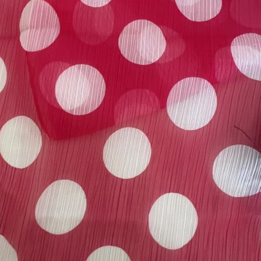dark pink red  with white polka dots on a red background
