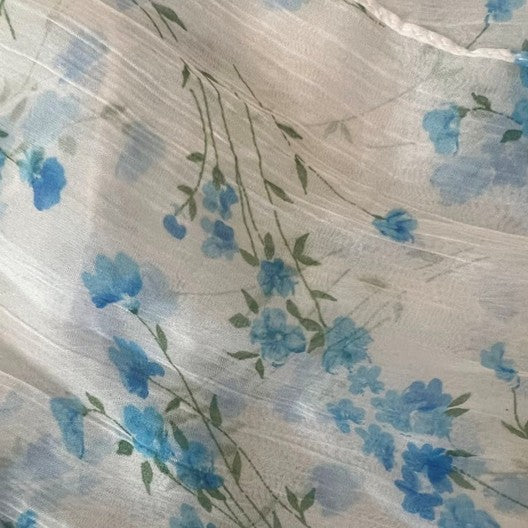 Floral pattern with blue flowers on a textured white background