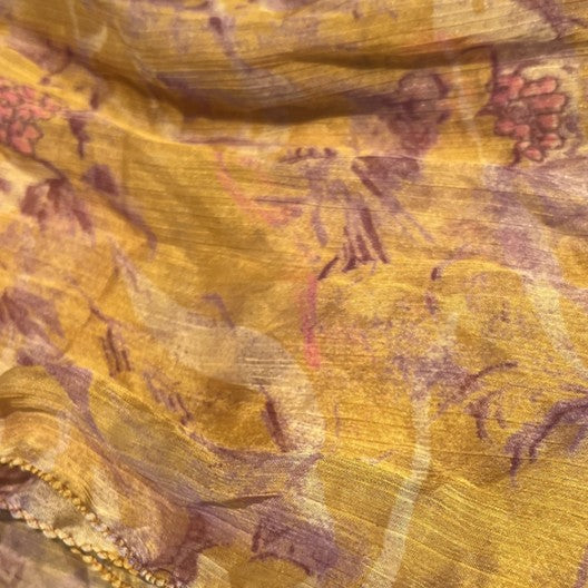 a yellow fabric with floral pattern
