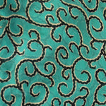 green chiffon scarf with swirls and ruffle trim all along the edges