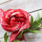 For mother's day gift a scarf which is rolled up like a flower. 