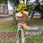 a  Mayil scarf and a bouquet of flowers