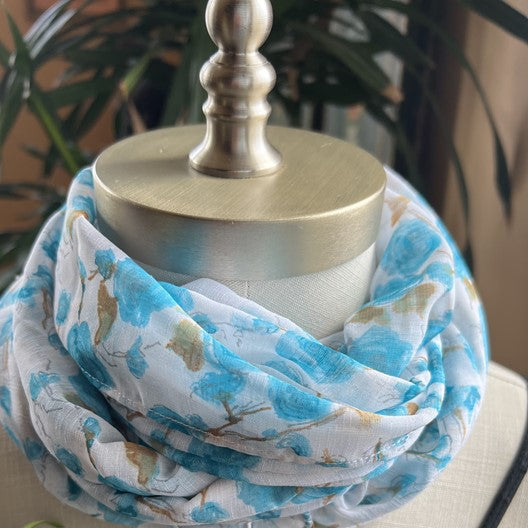 A pretty white scarf with small blue flowers